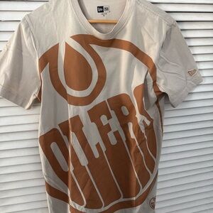 New Era Men’s Cream Tee with Brown Graphic